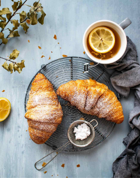 Tasty croissant and tea for perfect breakfast 1 img 1 2